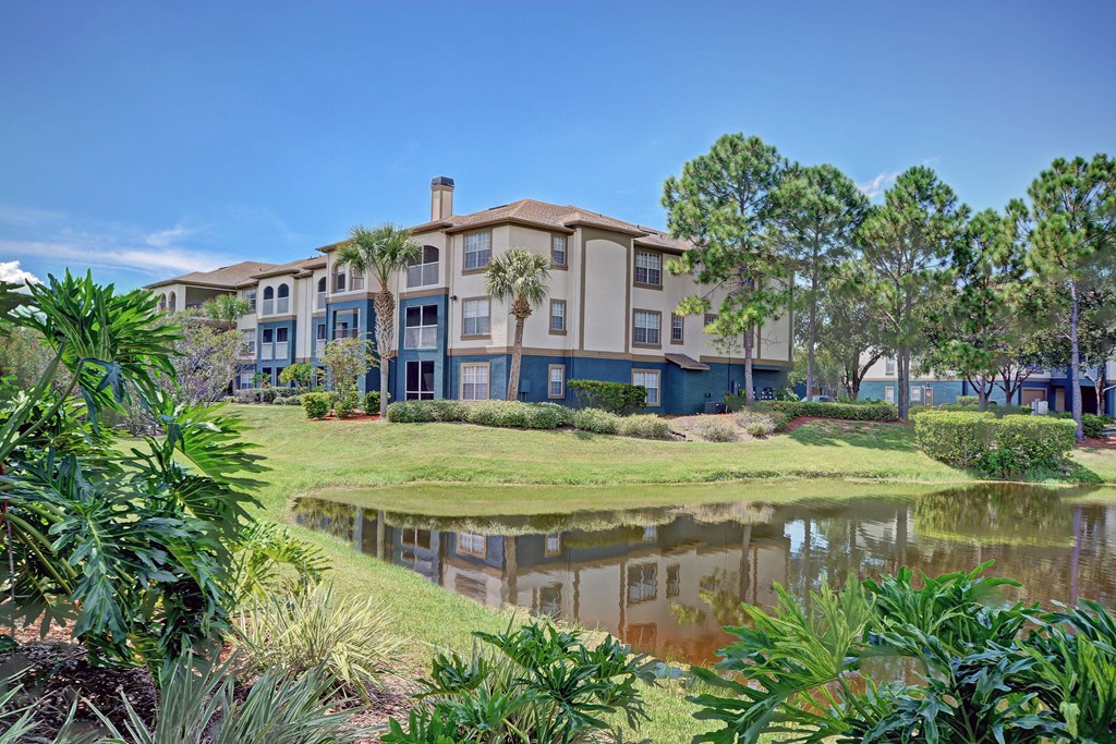 a building with a pond in front of it