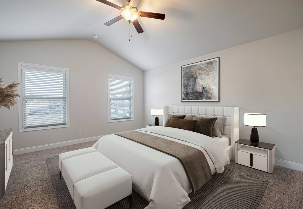 a bedroom with a bed and a ceiling fan