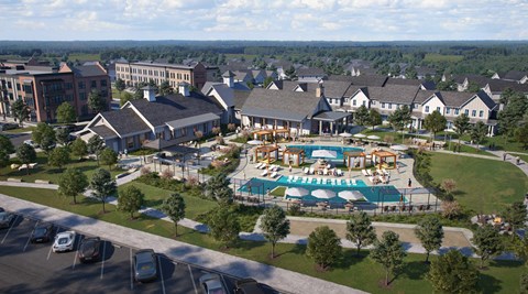 A large building complex with a pool in the middle.