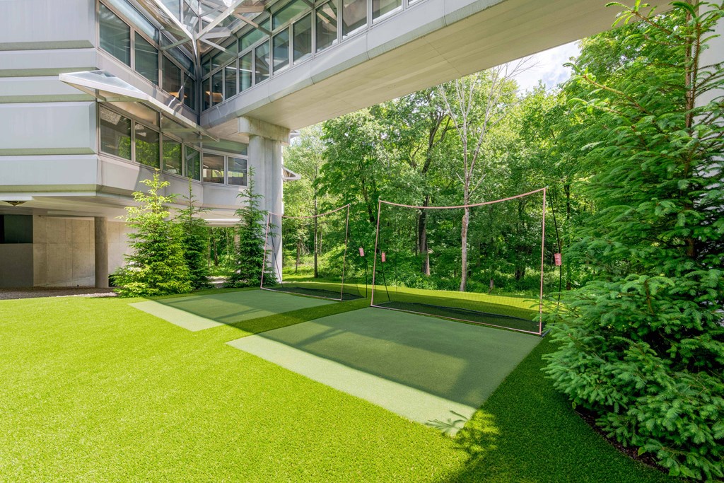 a swing set in the yard of an office building