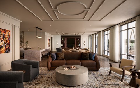 A modern living room with a grey sofa and a coffee table.