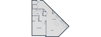 A floor plan of a living space showing a kitchen, bathroom, and bedroom.