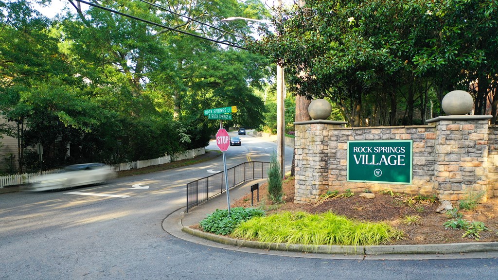a street corner with a sign for the rock springs village