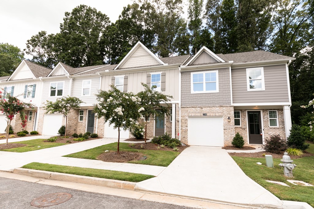 a white house with a white garage door