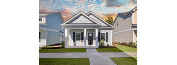 A house with a front yard and a driveway.