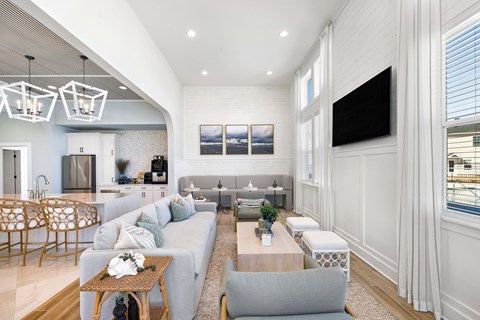 A modern living room with a grey sofa and a wooden coffee table.