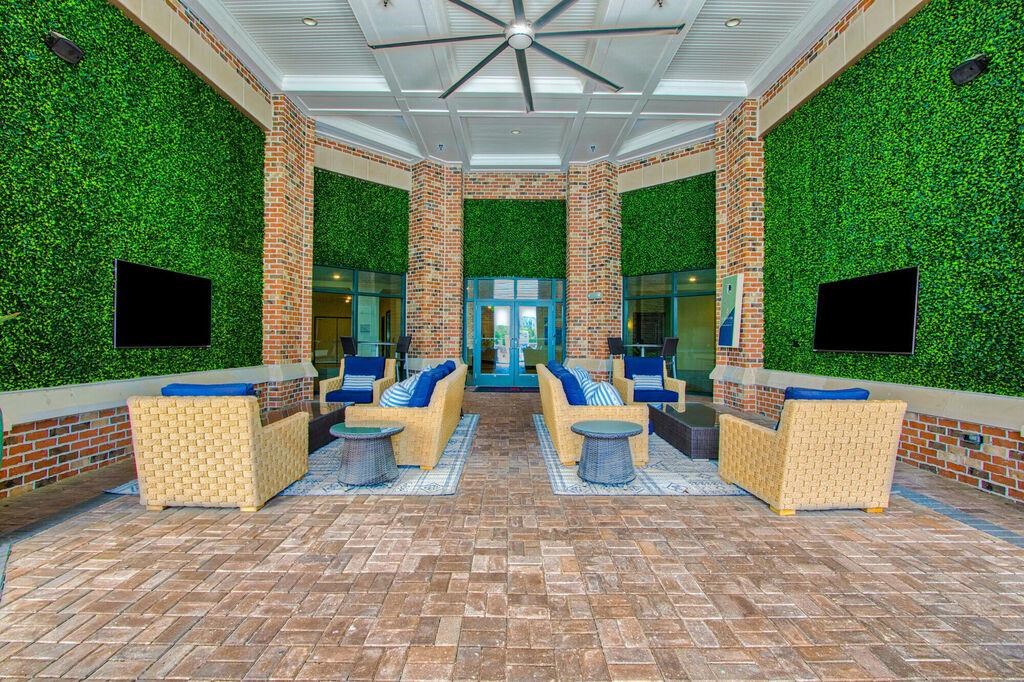 the lobby of a building with couches and chairs