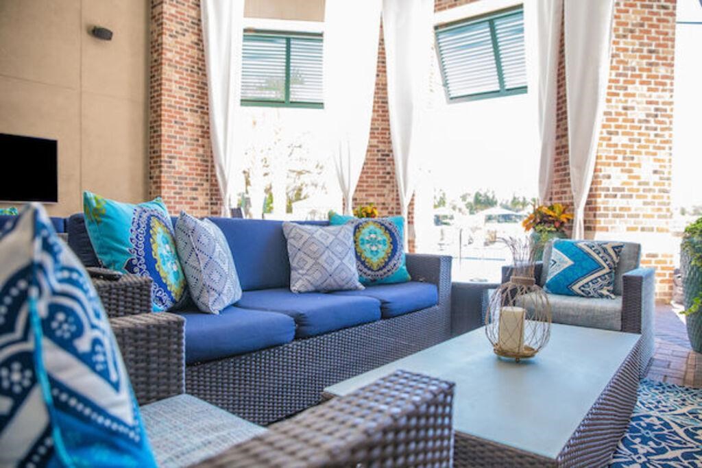 a living room with blue couches and a coffee table