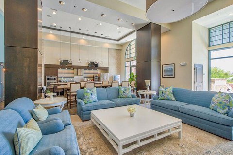 a living room with blue couches and a coffee table