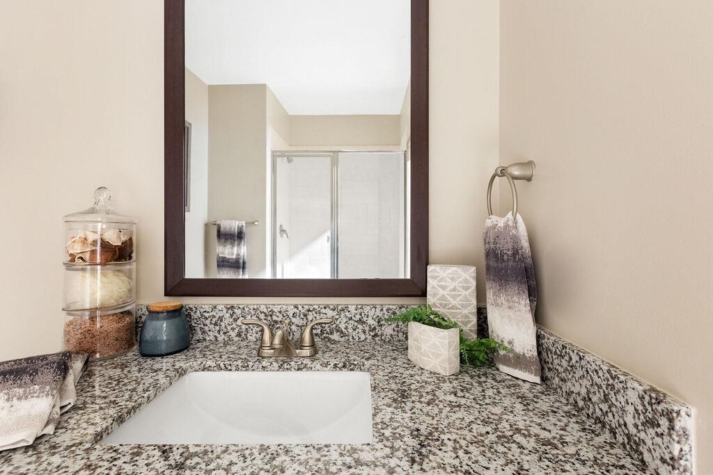 a bathroom with a sink and a mirror