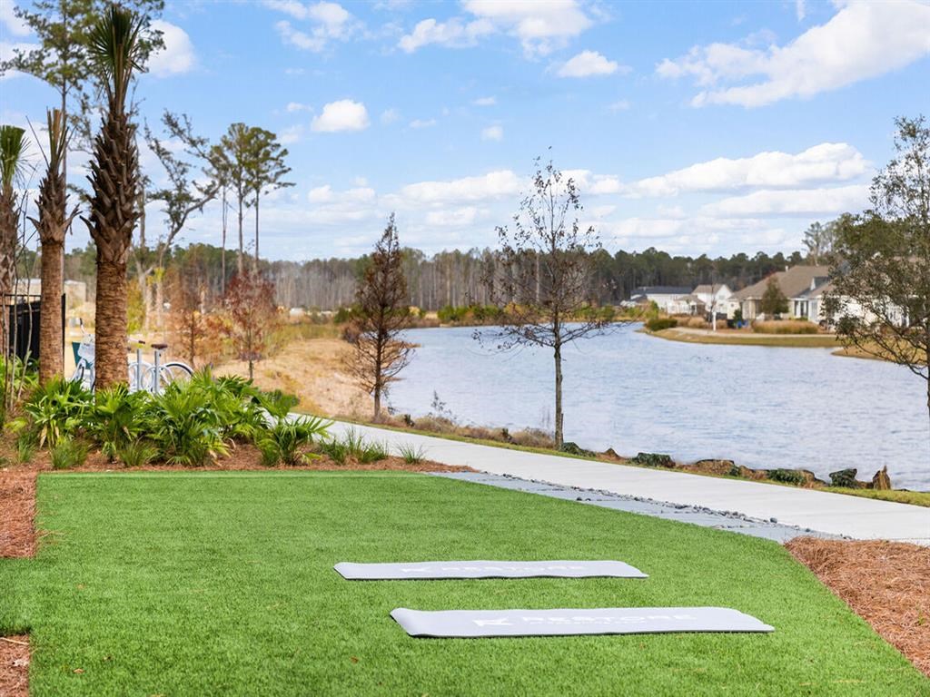a golf course next to a body of water