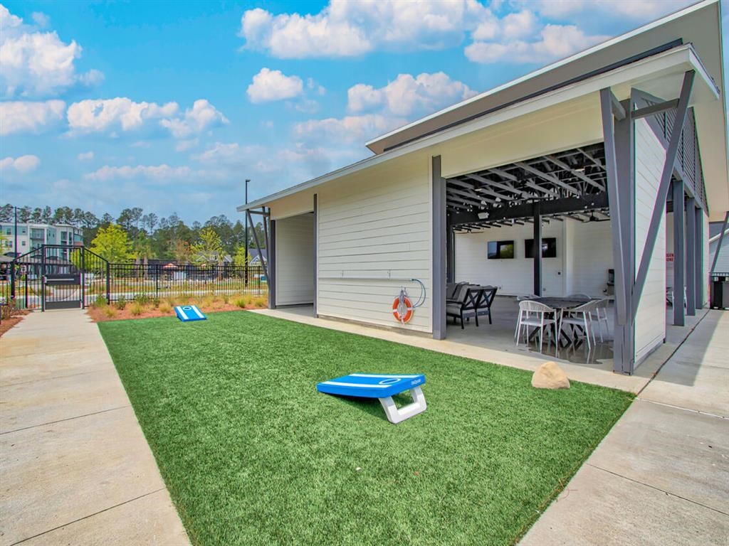 a small house with a yard and a patio