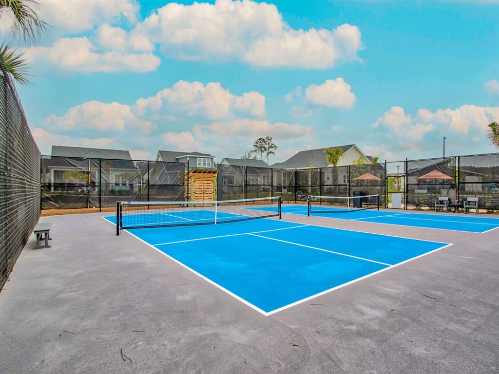 a tennis court with a blue court in the middle of a building