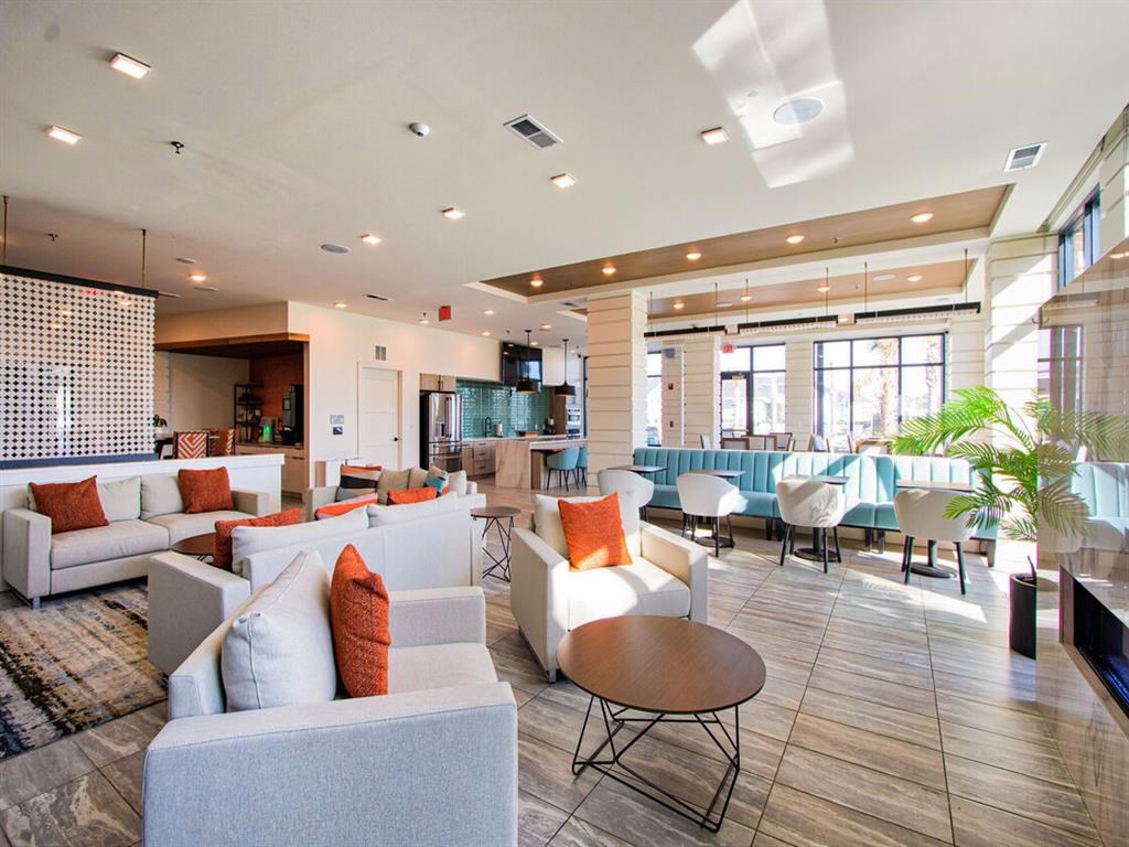 a large lobby with couches and tables and chairs