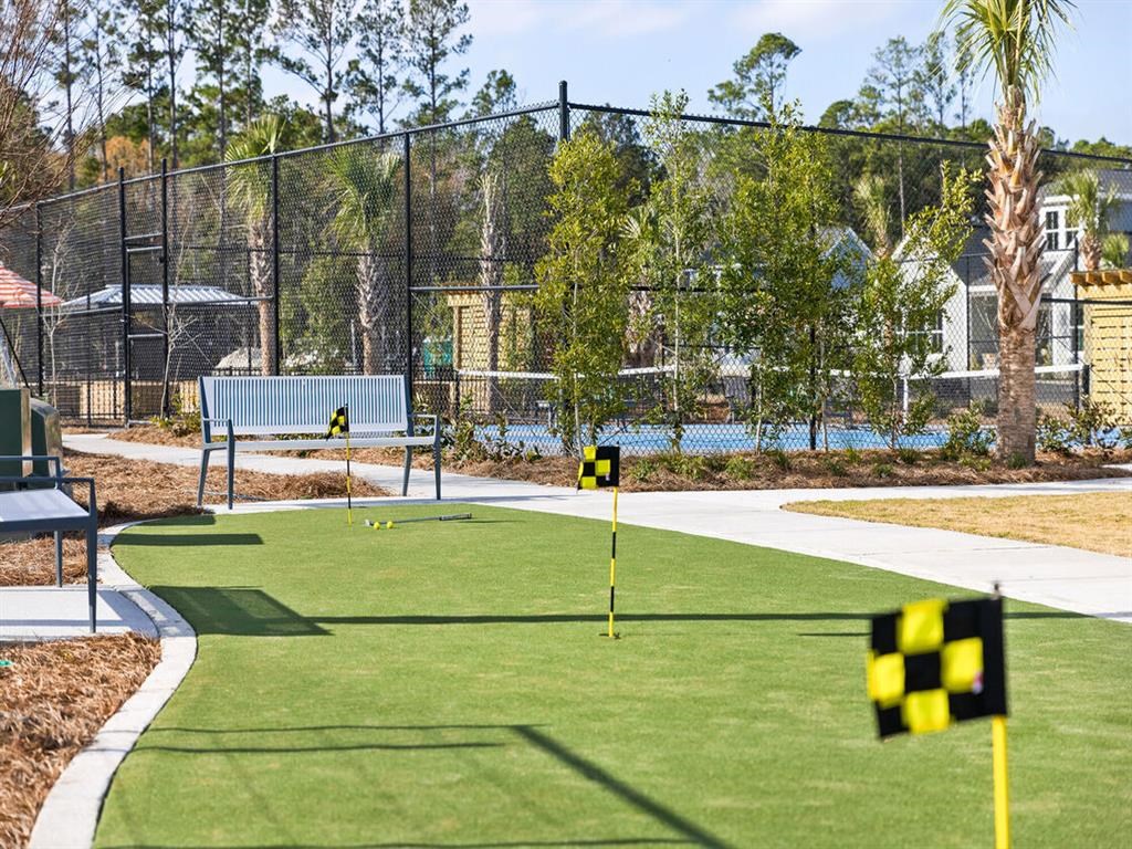 a park with a golf course and a tennis court