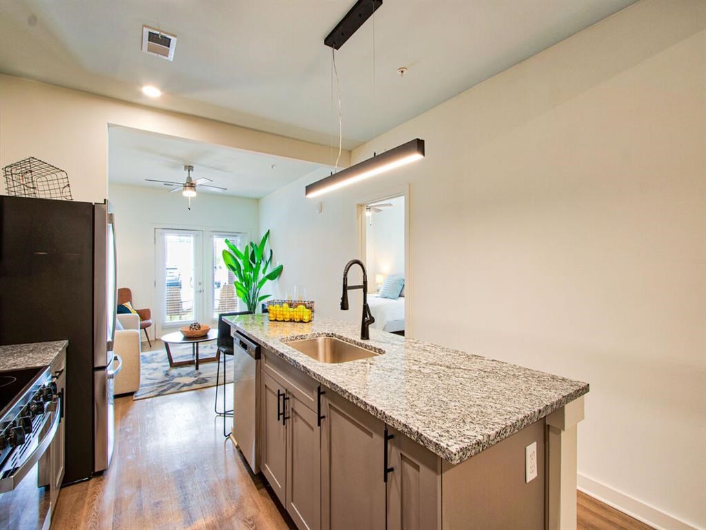a kitchen with a counter top and a sink