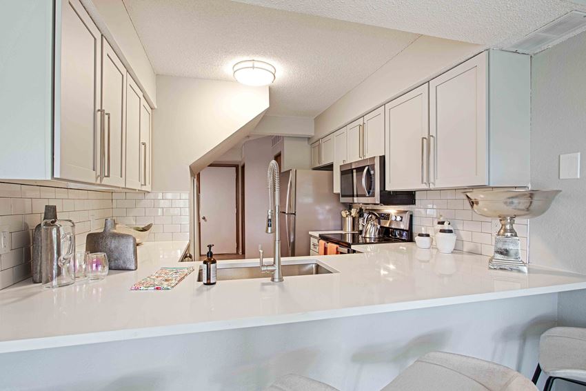 Upgraded kitchen with island bar seating - Photo Gallery