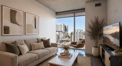 Modern apartment living room with floor-to-ceiling windows and Downtown Phoenix city views at Sora