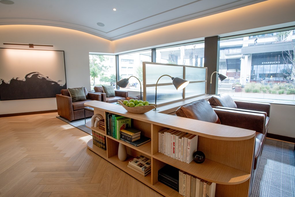 a living room with a couch and a bookshelf