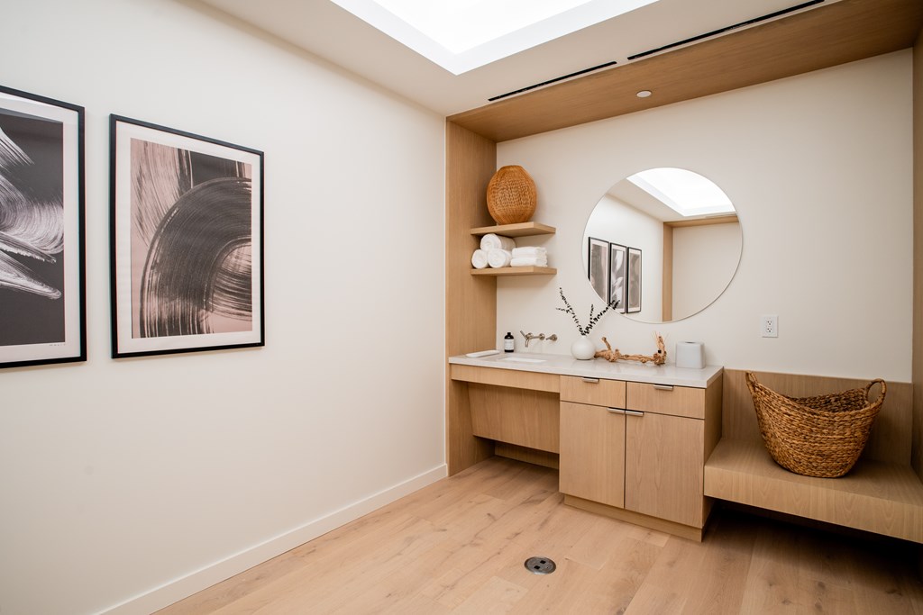 a bathroom with a vanity and a sink and a mirror