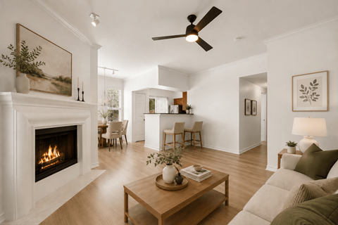 A living room with a fireplace at St Moritz in Dallas Texas
