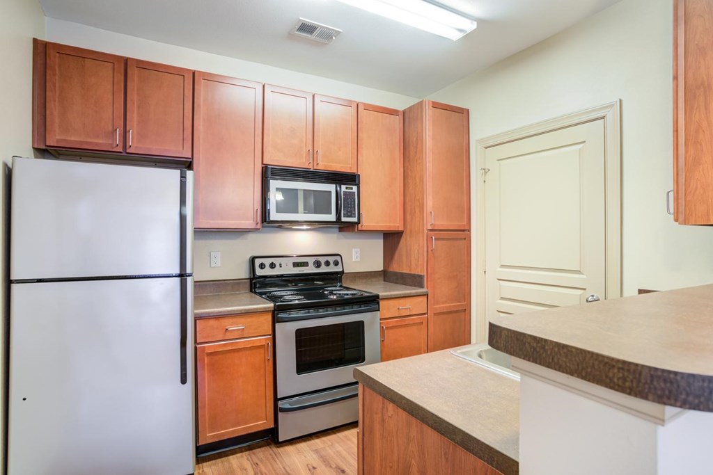 Apartments in Hendersonville TN - The Grove At Waterford Crossing - Kitchen with Built-In Microwave and Vinyl Plank Flooring