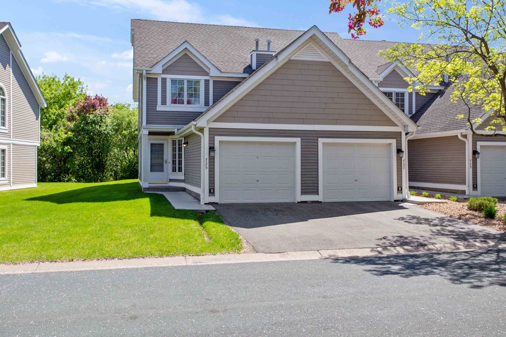 Exterior view of townhomes with garages