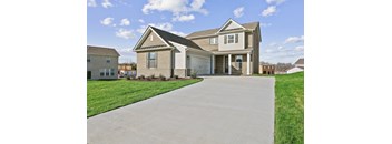 a large house with a driveway in front of it