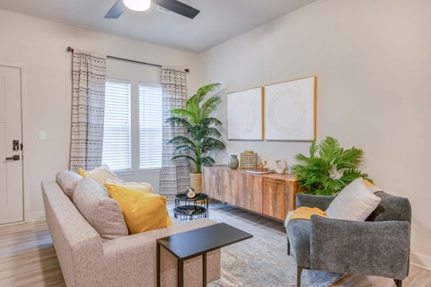 a living room with a couch and two chairs