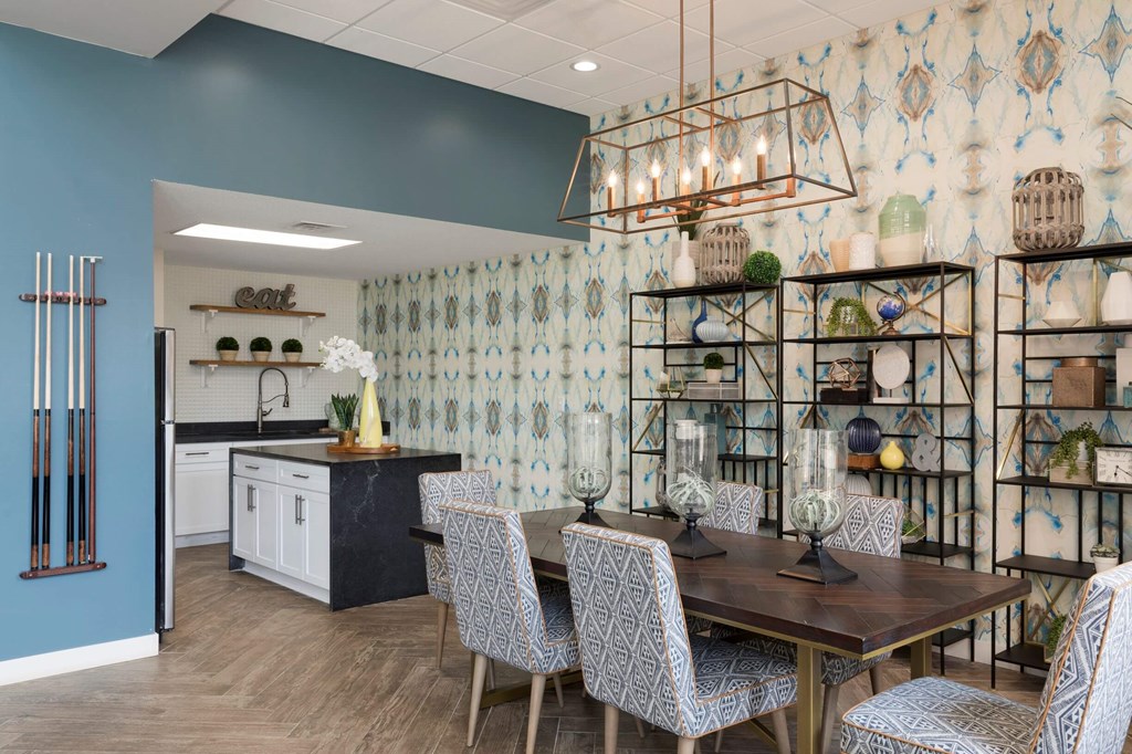 a dining room with a table and chairs