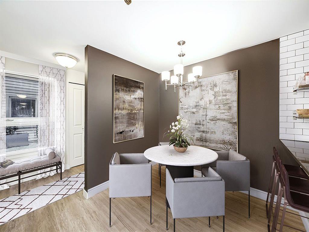 a dining room with a table and chairs