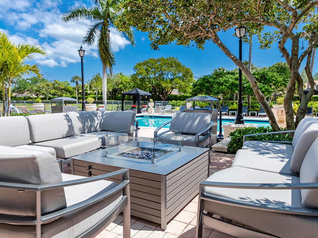 a pool with lounge chairs and a table