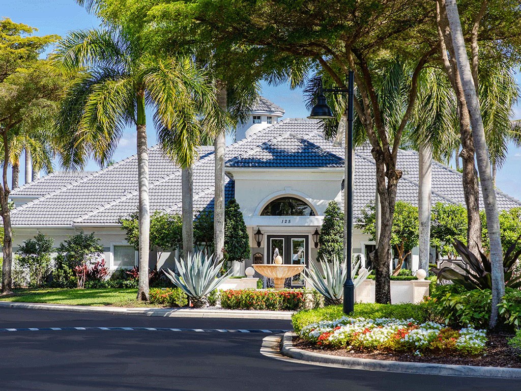 a house with palm trees in front of it