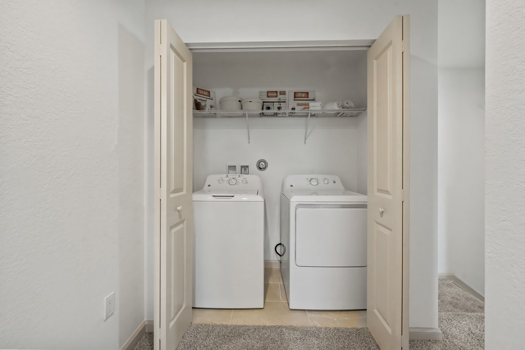 a laundry room with two washes and a dryer in it