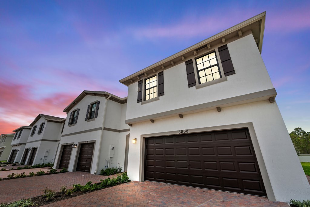 a group of houses with garage doors