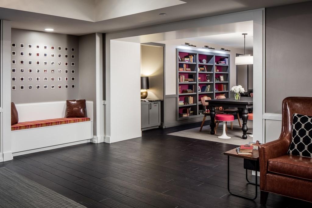 a living room and dining room with a table and chairs