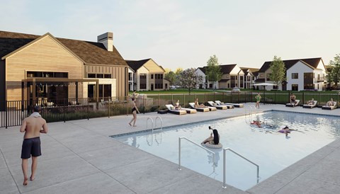 A group of people are enjoying a swimming pool in front of a house.