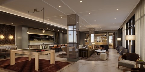 A modern living room with a pool table and a kitchen area.