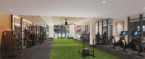 A gym with a variety of equipment including treadmills, weights, and exercise machines.