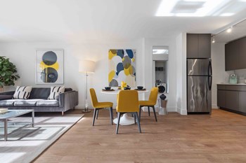 Furnished living room with open concept living spaces - Photo Gallery 3
