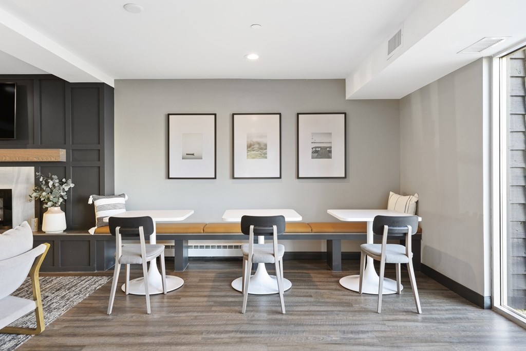a dining room with a table and chairs and a fireplace
