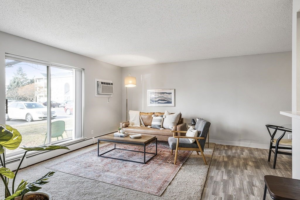 a living room with a couch and a large window