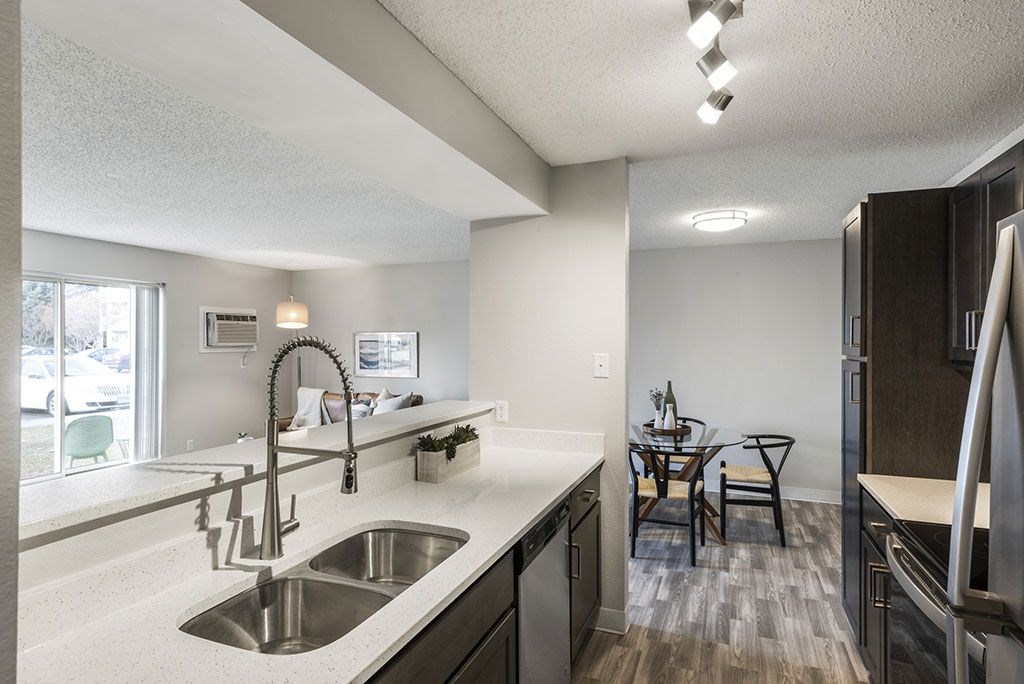 a kitchen with a sink and a counter top