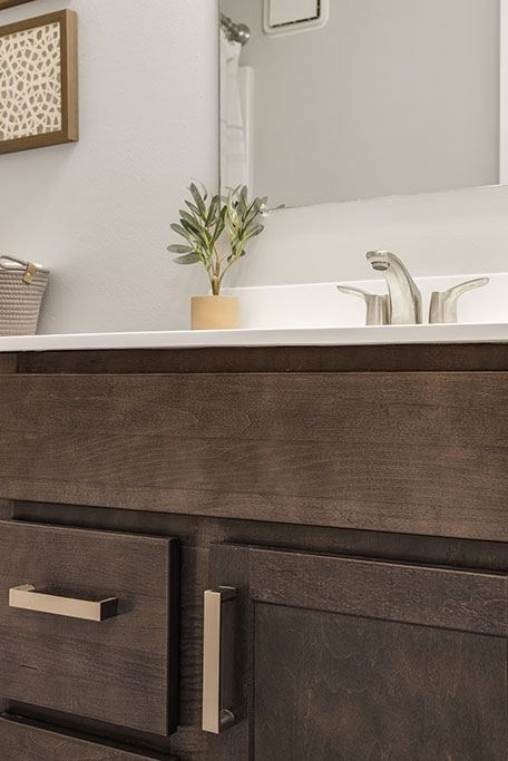 a bathroom vanity with a sink and a mirror