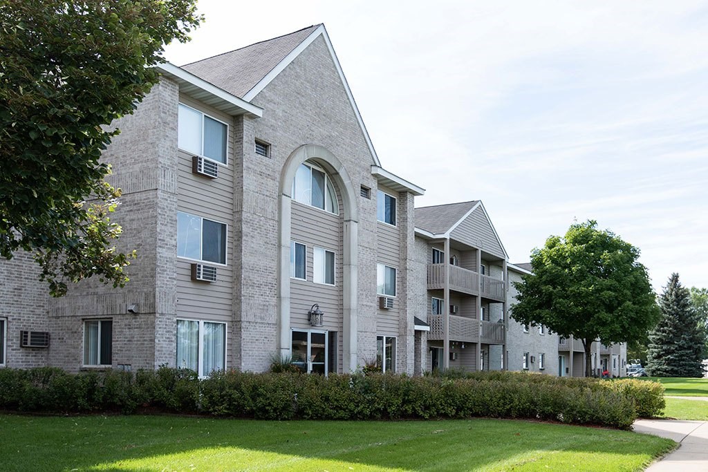 our apartments are located in a quiet neighborhood with a green lawn