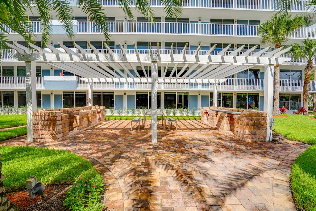 a large patio with a building in the background