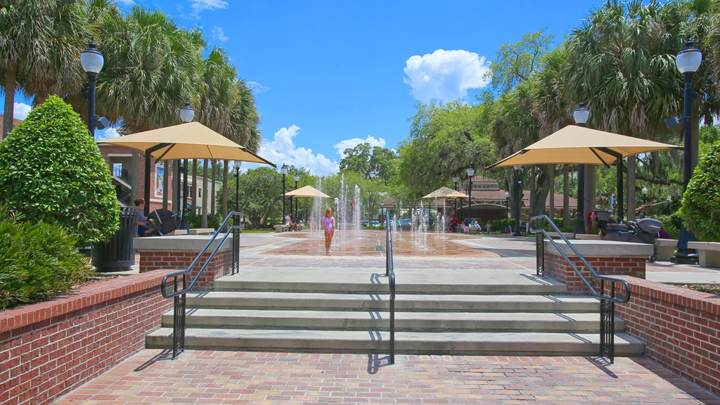 a fountain in the middle of a park