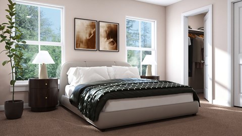 A bedroom with a large bed and a potted plant.