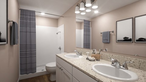 A bathroom with a sink, toilet, and shower.