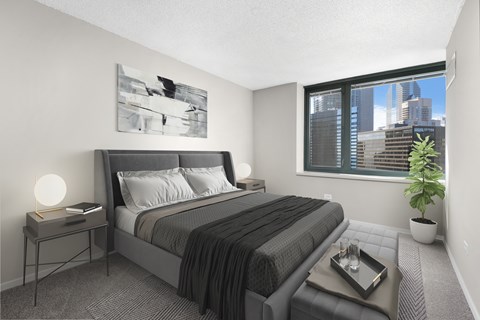 Furnished bedroom with large windows